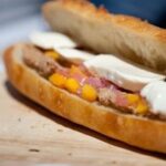 Beef Brisket, Fresh Mozzarella and Mango-Pickled Red Onion Relish on a Baguette